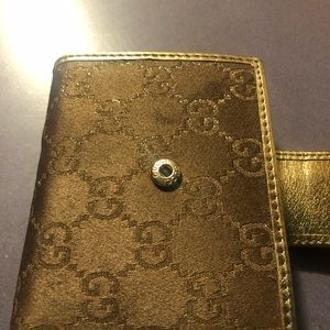 Gucci wallet brown and gold leather.